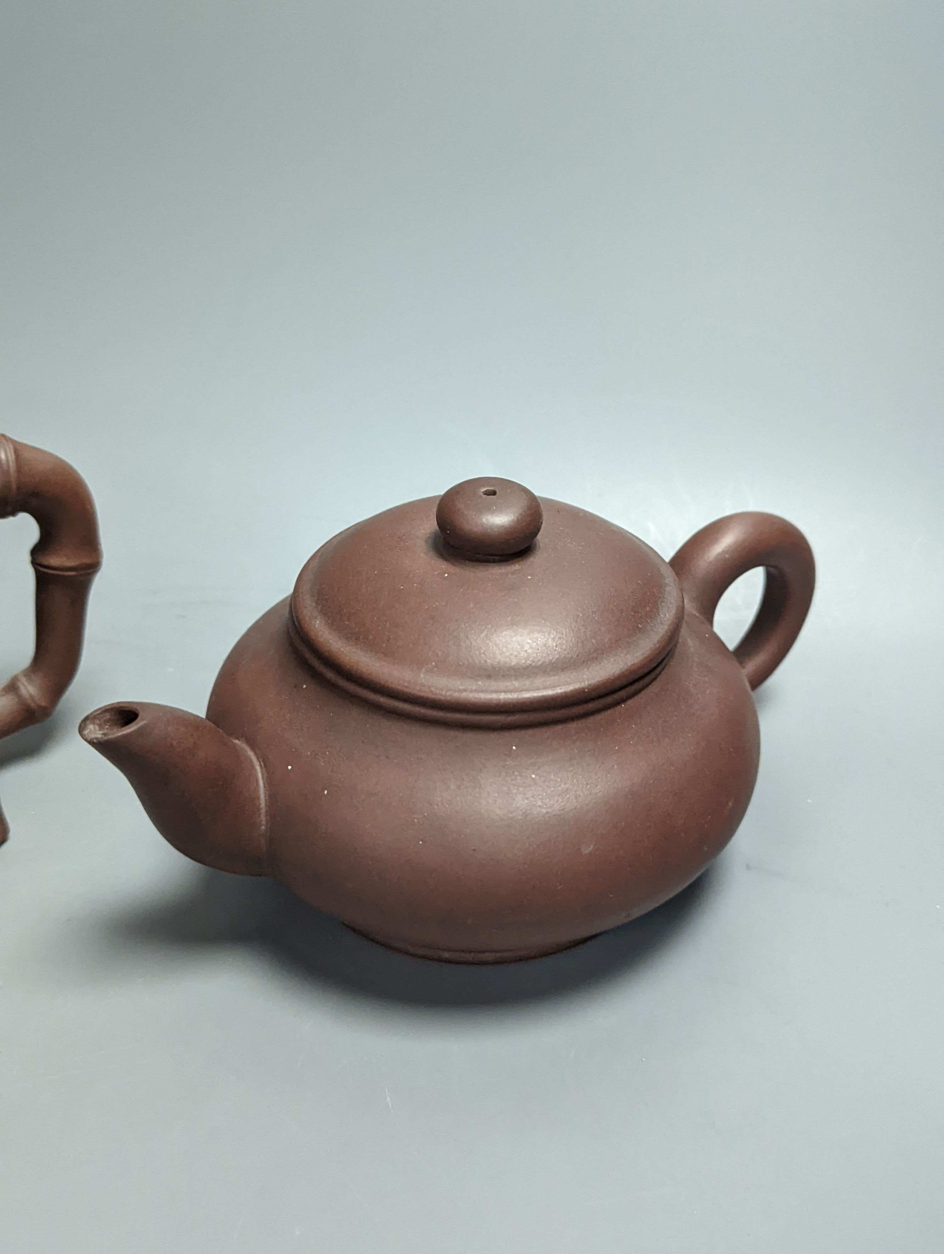 Three Chinese Yixing teapots, tallest 10.5cm